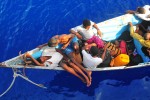 090525-N-4774B-032
GULF OF ADEN (May 24, 2009) Somali migrants in a disabled skiff wait for assistance from Sailors aboard the guided-missile cruiser USS Lake Champlain (CG 57). The skiff, originally ferrying 52 passengers, was spotted in distress by helicopter pilots assigned to the "Wolfpack" of Helicopter Anti-Submarine Squadron Light (HSL) 45 while patrolling the area. Lake Champlain is deployed as part of the Boxer Expeditionary Strike Group supporting maritime security operations in the U.S. 5th Fleet area of responsibility. (U.S. Navy photo by Mass Communication Specialist 2nd Class Daniel Barker/Released)